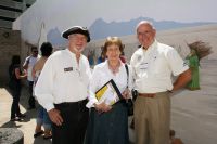 Warren Edminster, Beth Walkup, and the Honorable Robert Walkup in front of the mural wall at Presidio San Agustin del Tucson. Photo courtesy Richard Whitmer.